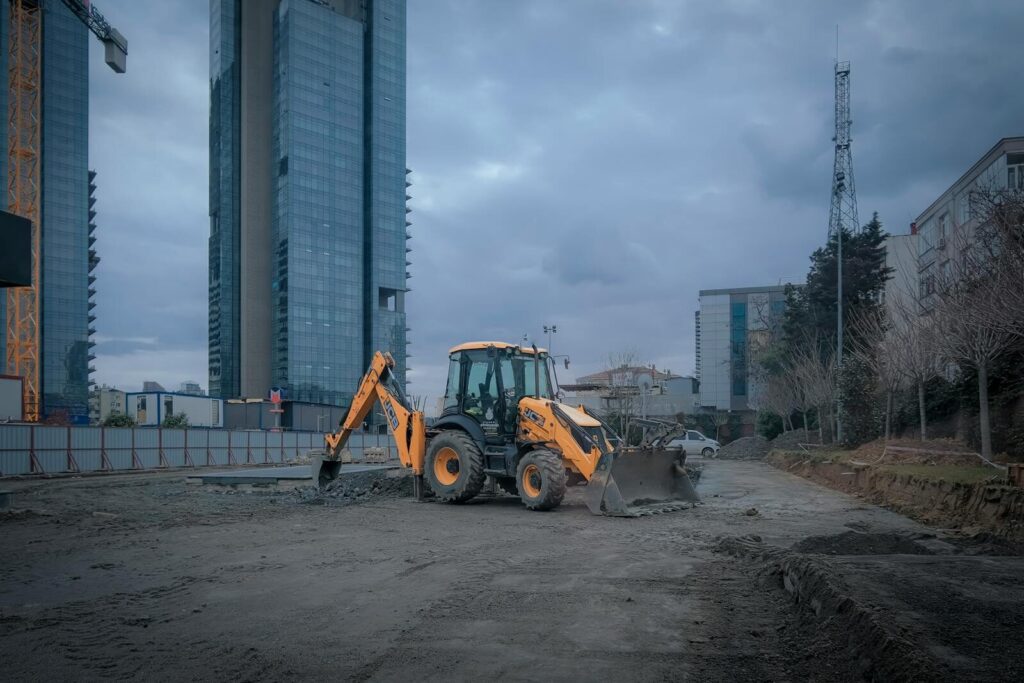 A vibrant urban construction site with excavator in Istanbul, Türkiye.